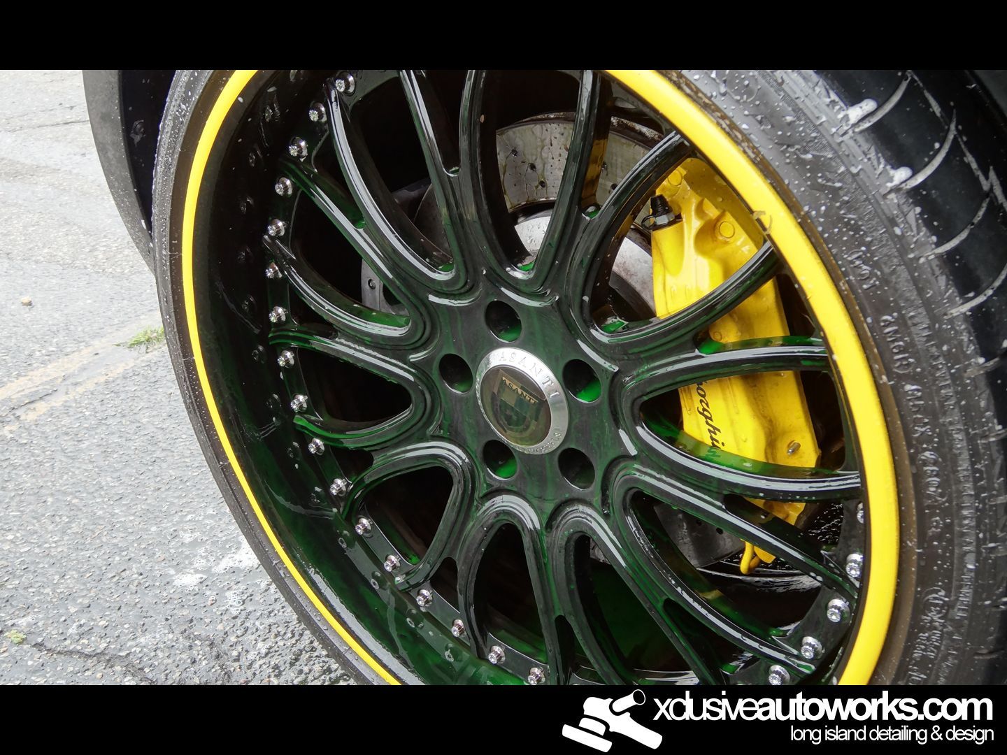 A close up of a car wheel with xdusveautoworks.com written on the bottom