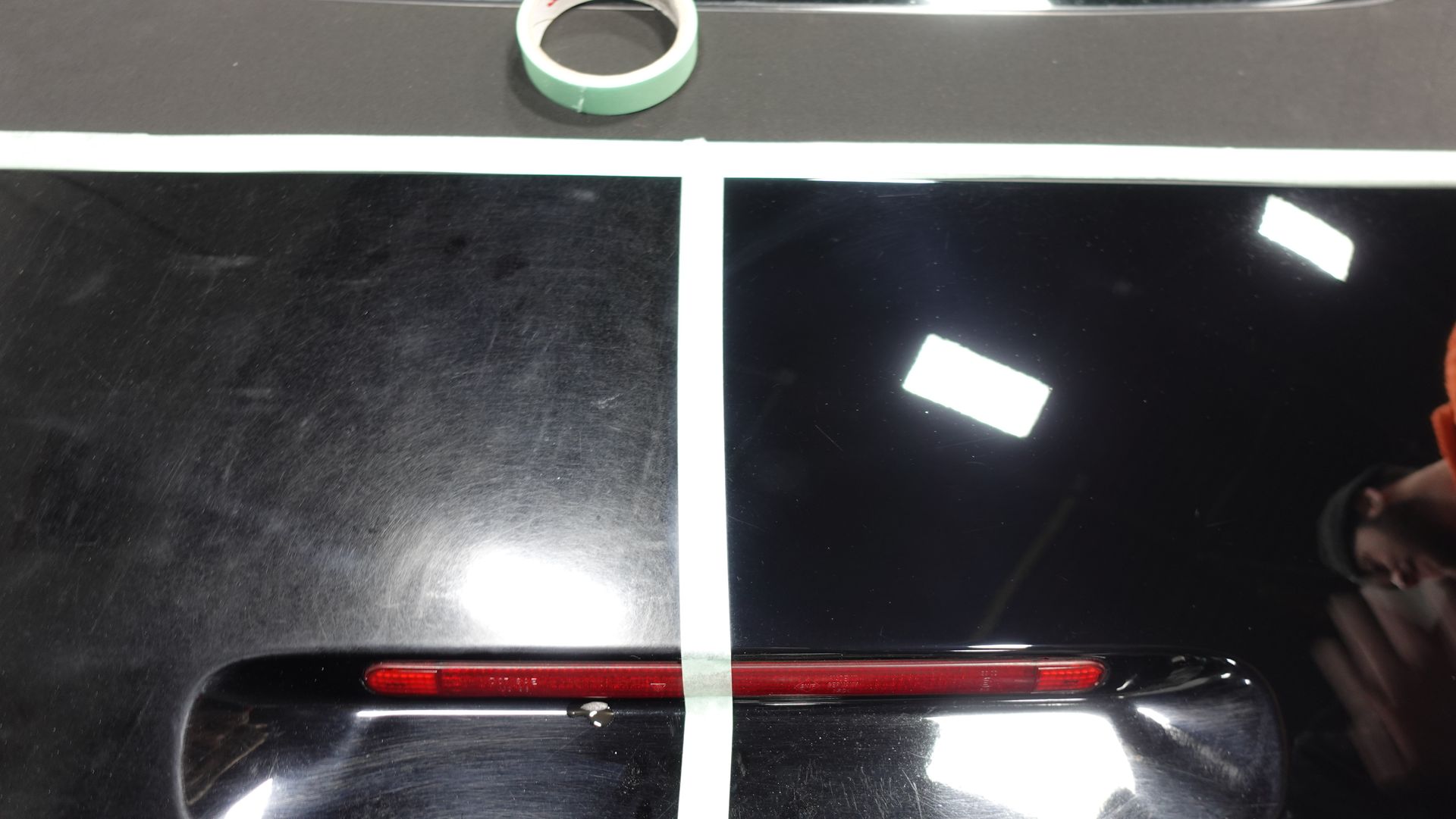 A black surface with a red light on it