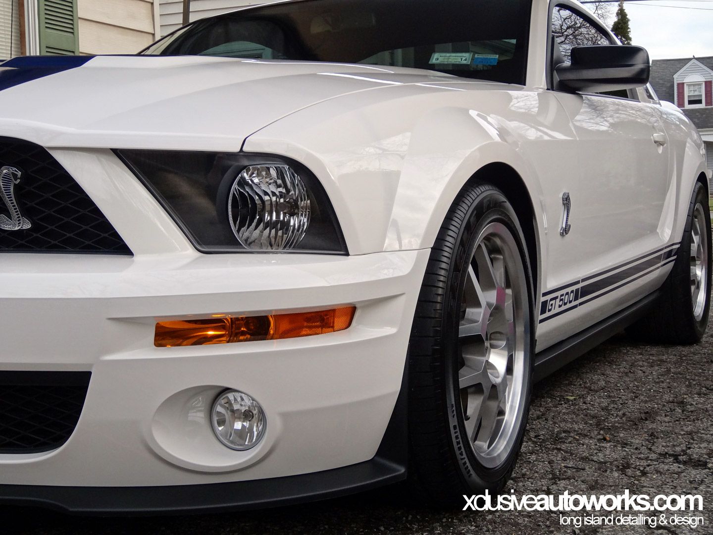 A white mustang with the number 3 on the side