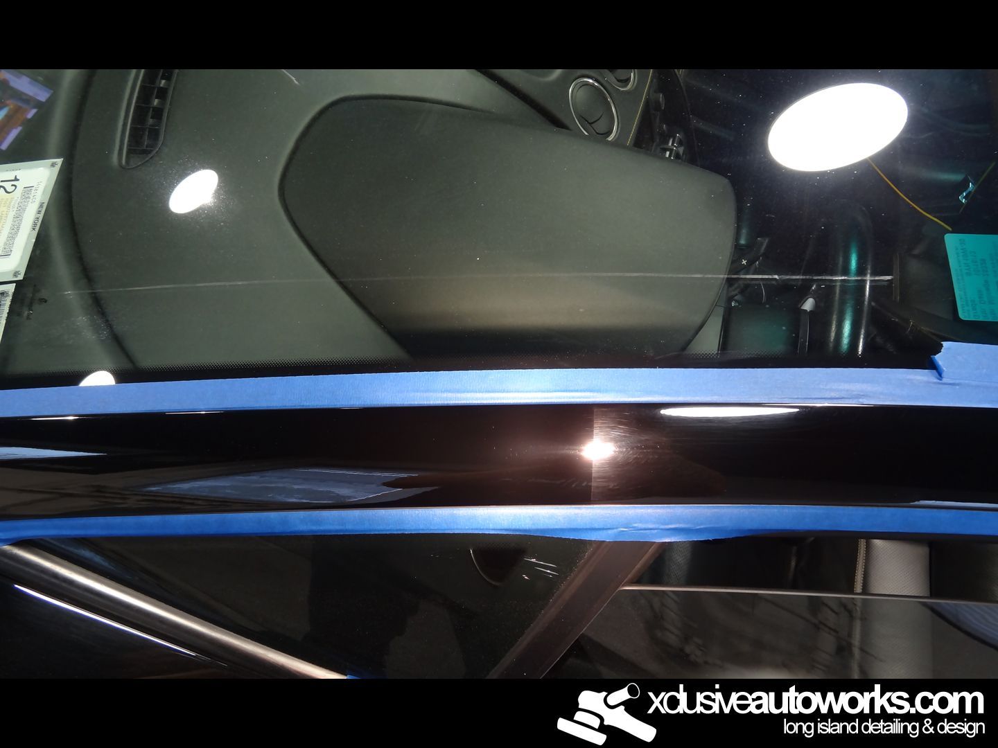 A picture of a car with xclusiveautoworks.com written on the bottom