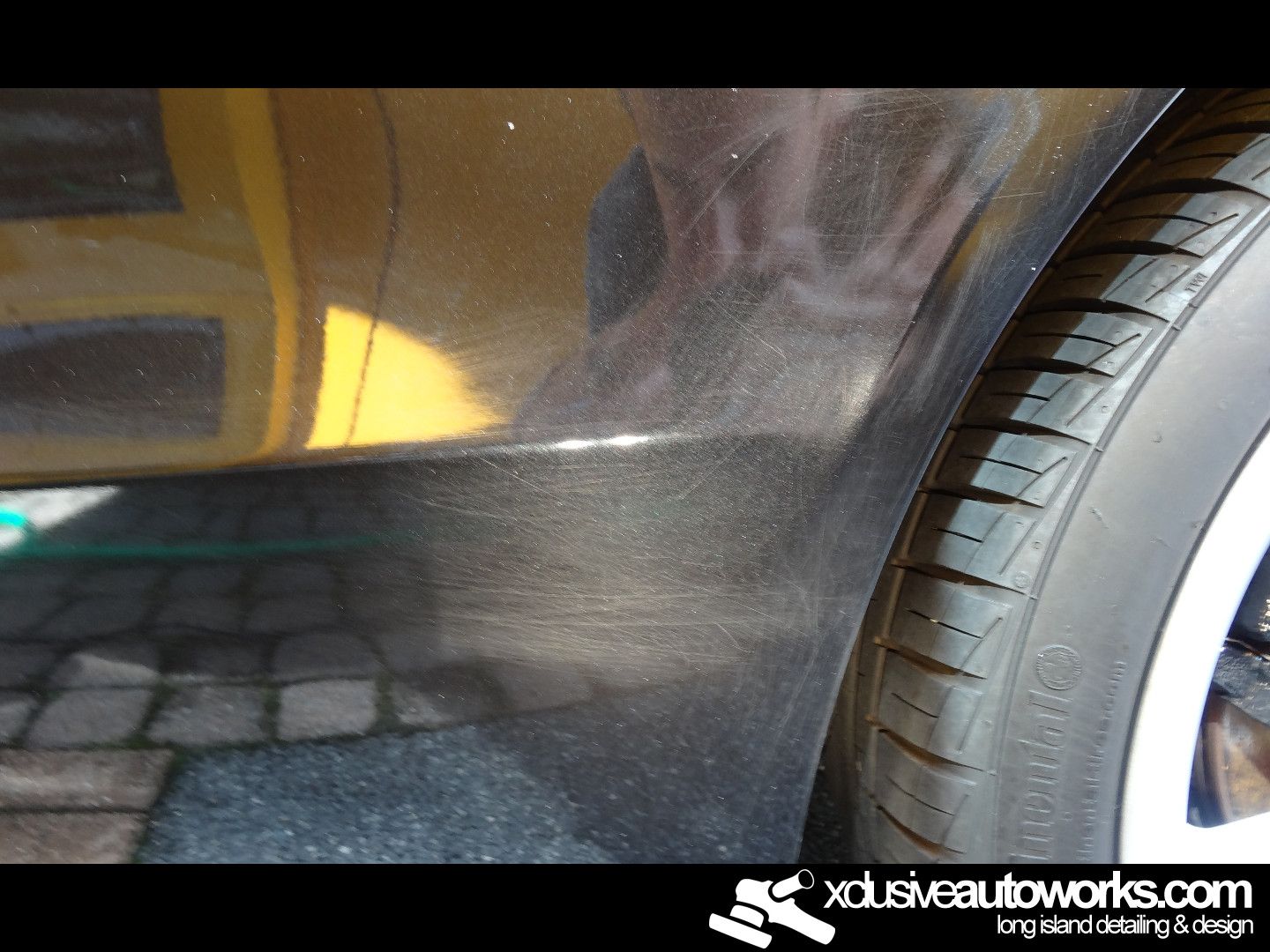 A close up of a car with the website xdusveautoworks.com on the bottom