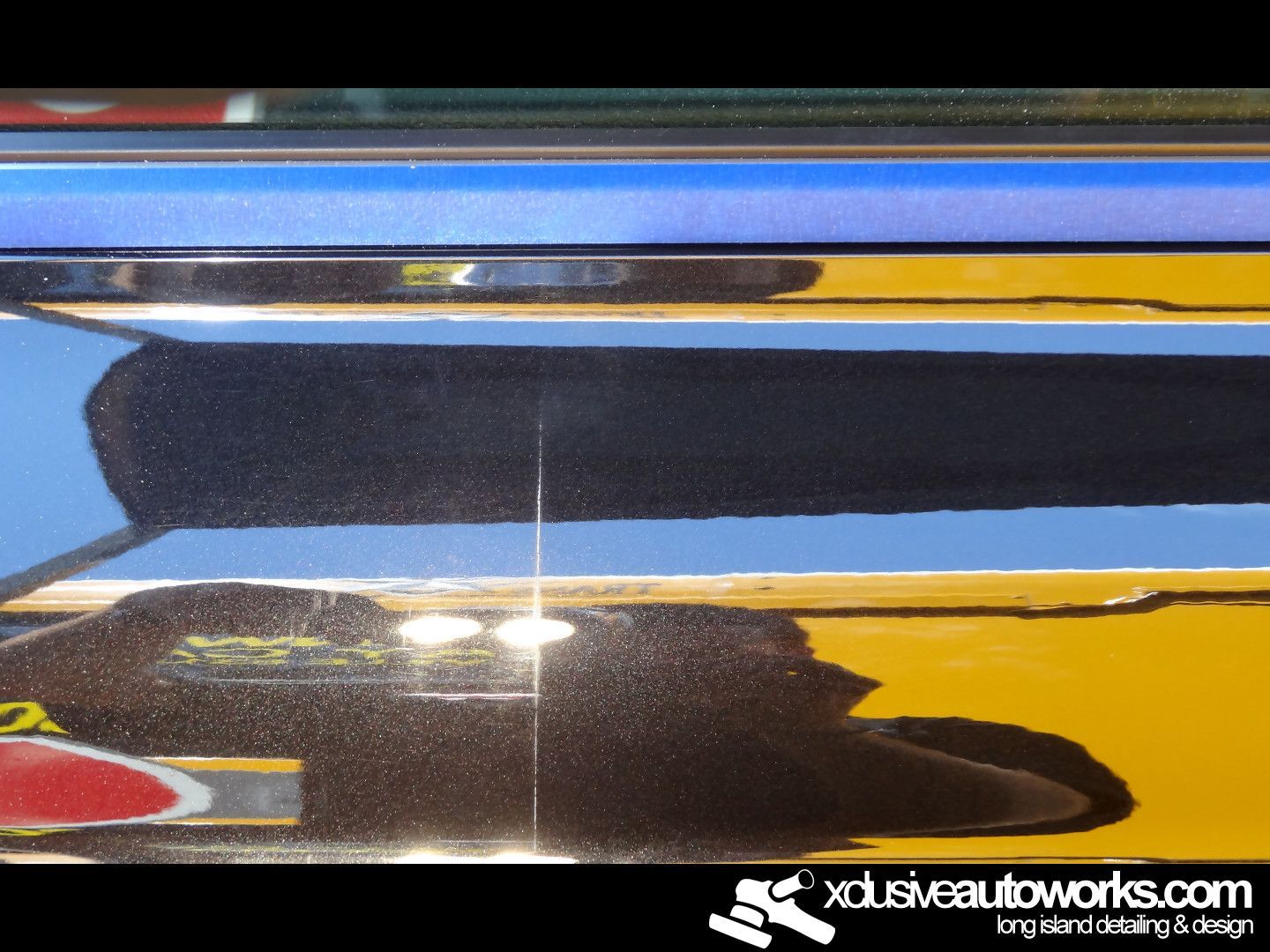 A close up of a car with the website xdusveautoworks.com at the bottom