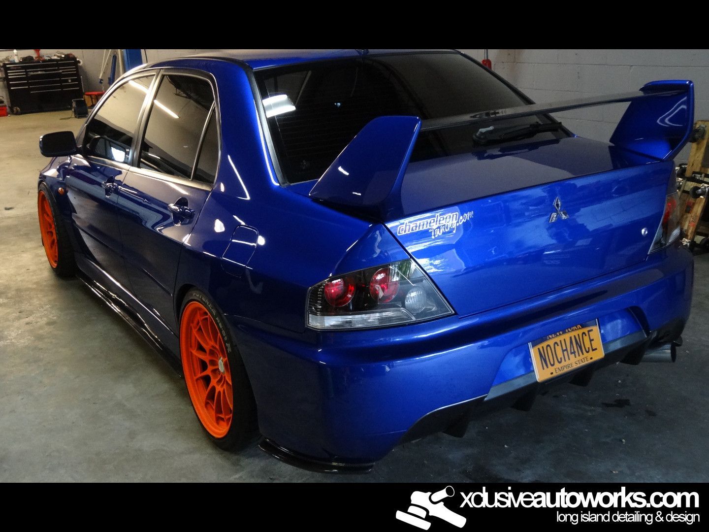 A blue car with a new york license plate