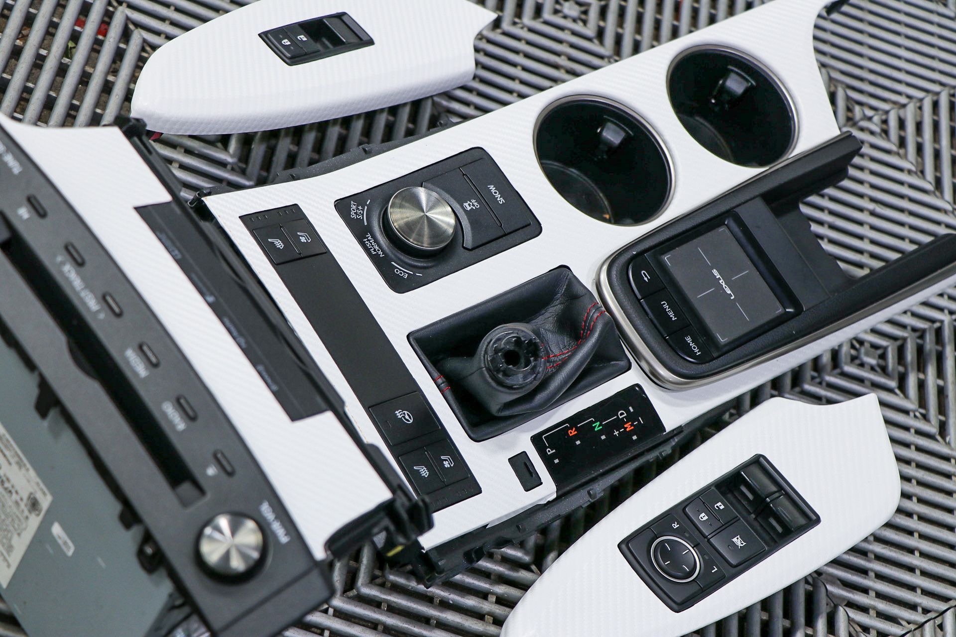 A bunch of electronics are sitting on top of each other on a table.