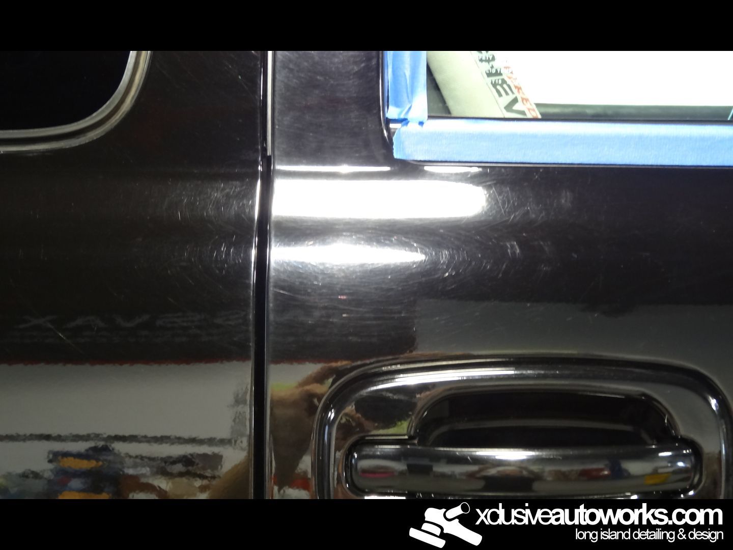 A close up of a car door with xdusveautoworks.com written on the bottom