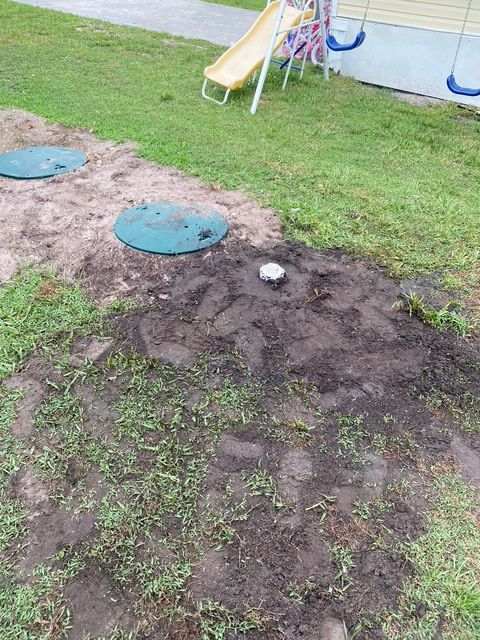 There is a playground in the background with a slide and swings.