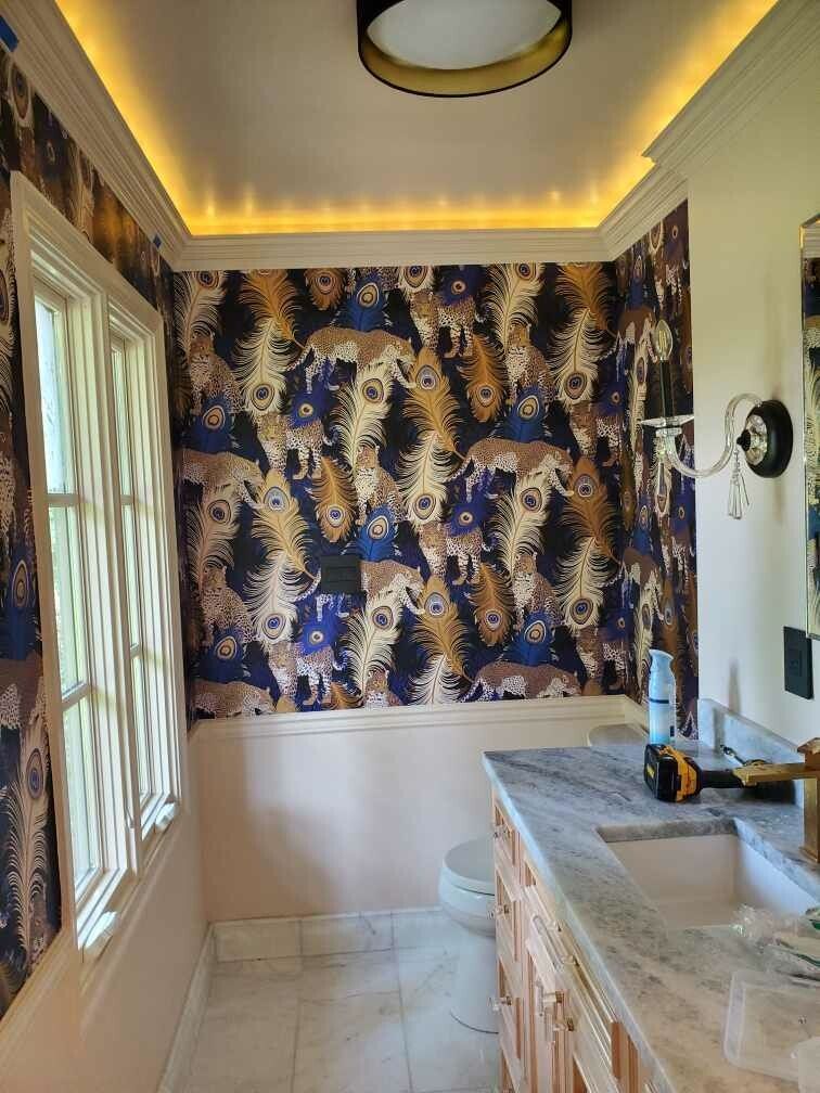 A bathroom with a sink , toilet , and mirror.