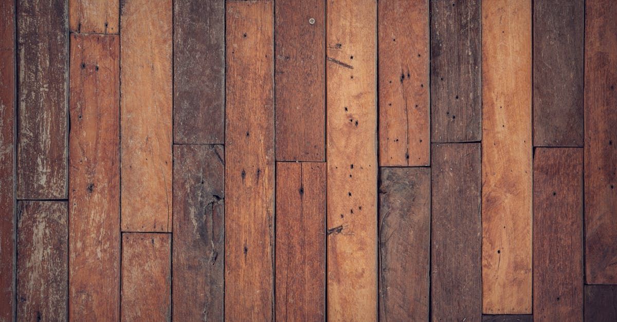 A close up of a wooden floor made of wooden planks.