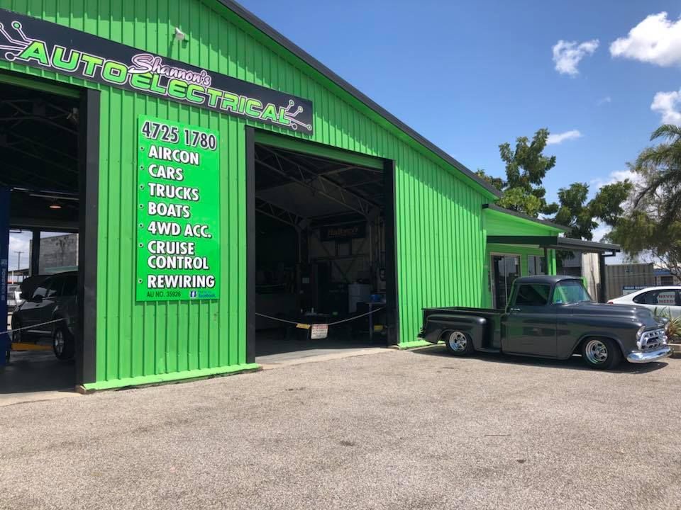 Green Auto Electrical Shop With a Vintage Gray Pickup Truck Parked Outside. Sign Lists Services for Cars, Trucks, Boats, and More — Shannon's Auto Electrical in Garbutt, QLD
