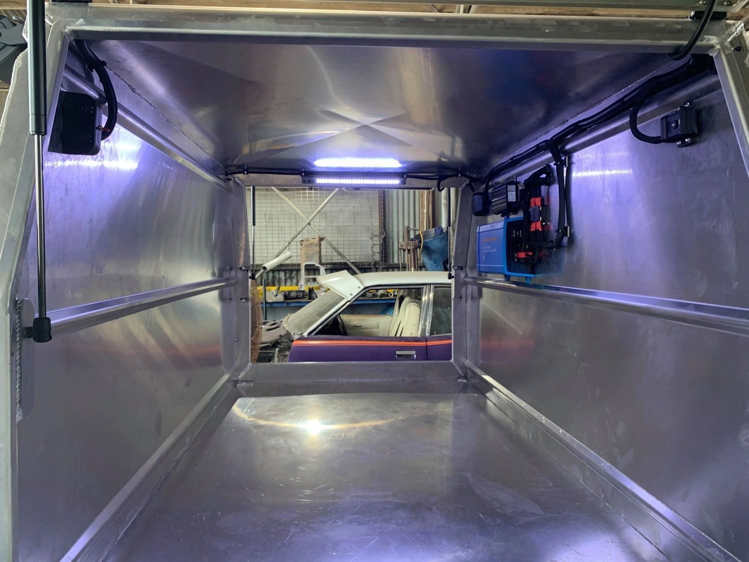 Inside of an Aluminum Truck Bed Canopy, Empty With a Light Bar and Wiring — Shannon's Auto Electrical in Garbutt, QLD