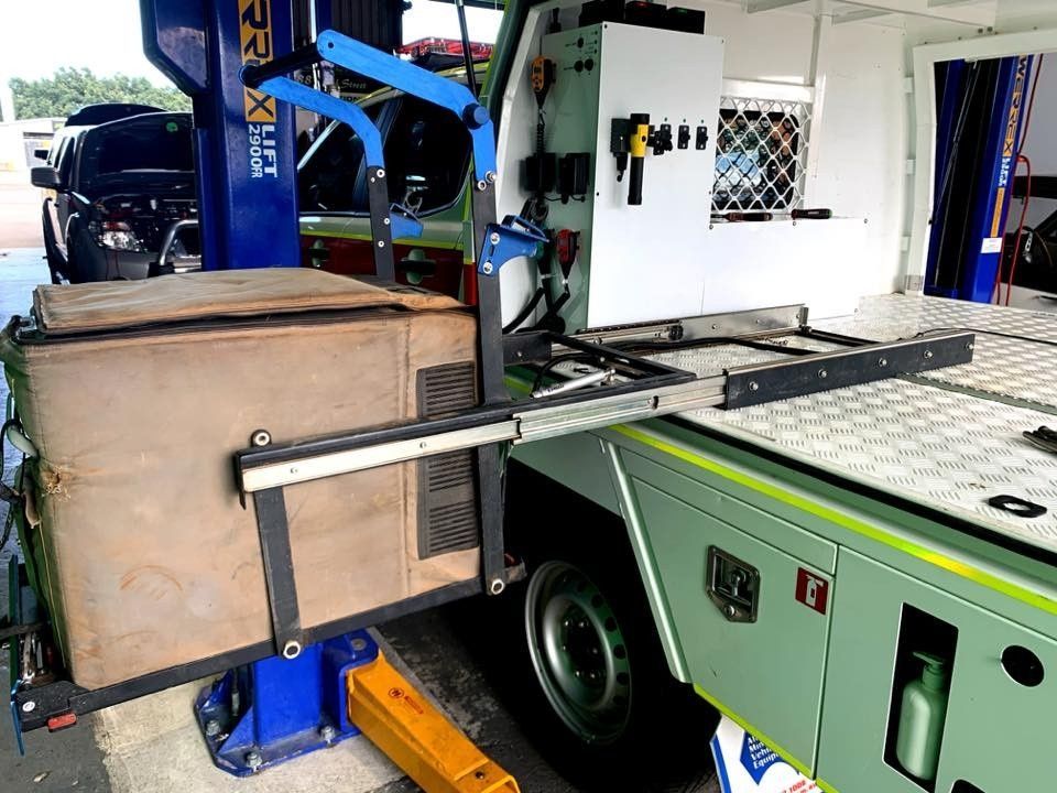 A Mechanic's Truck Being Worked on With a Car Lift, Tools, and an Attached Box — Shannon's Auto Electrical in Garbutt, QLD