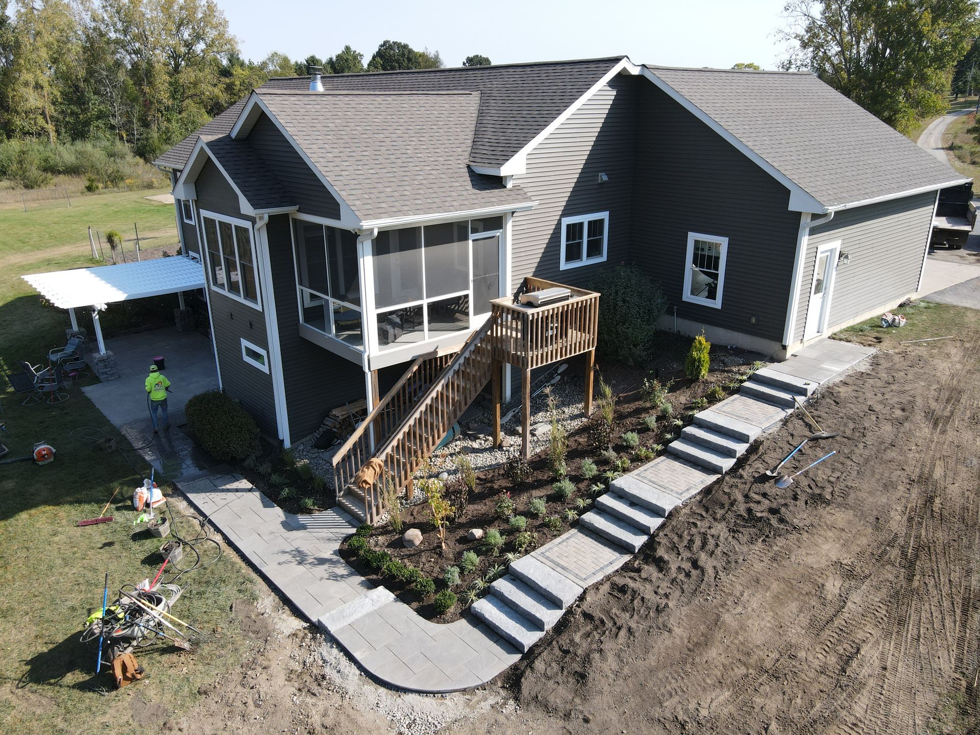 An aerial view of a house with a walkway leading to it.