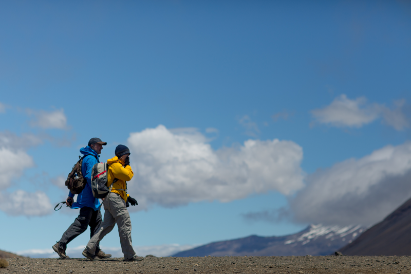 Two people hiking in summer on a fine day on the Tongariro Alpine Crossing