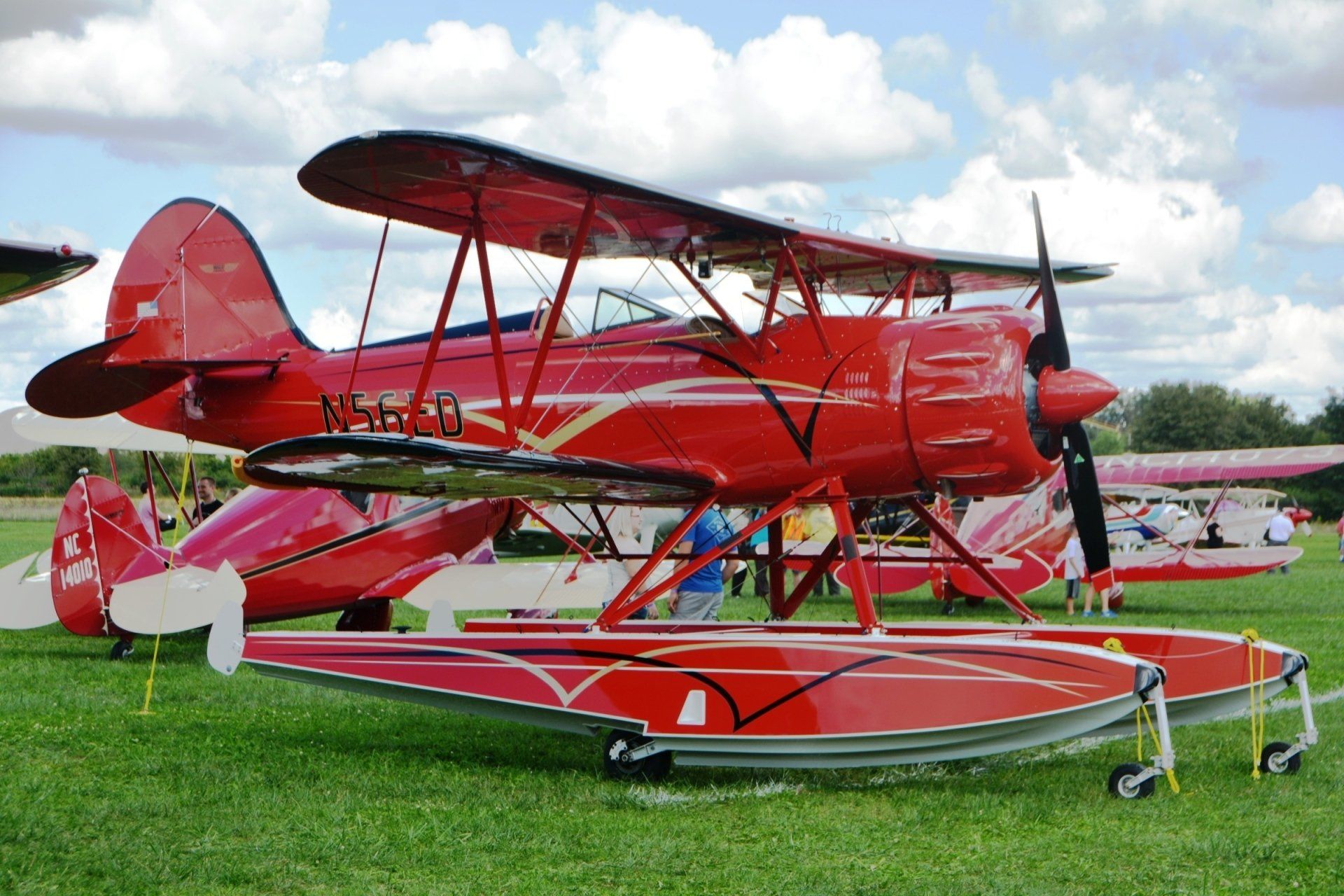 A red airplane with the letters nmh on the side