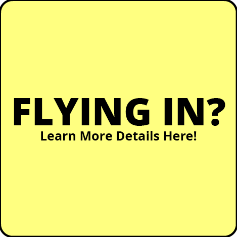 A yellow sign that says `` flying in ? learn more details here ! ''