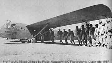 A group of people are standing in front of an airplane.