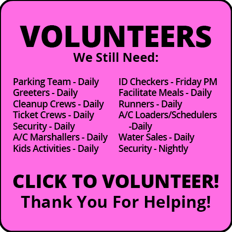 A pink sign that says volunteers we still need
