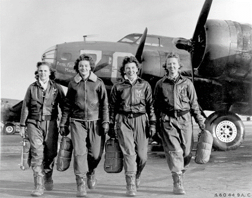 A black and white photo of a group of female fighter pilots