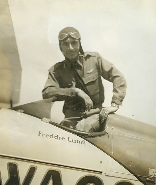 Freddie lund is sitting in the cockpit of an airplane