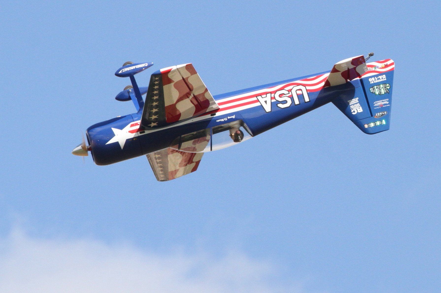 A usa airplane is flying in the sky