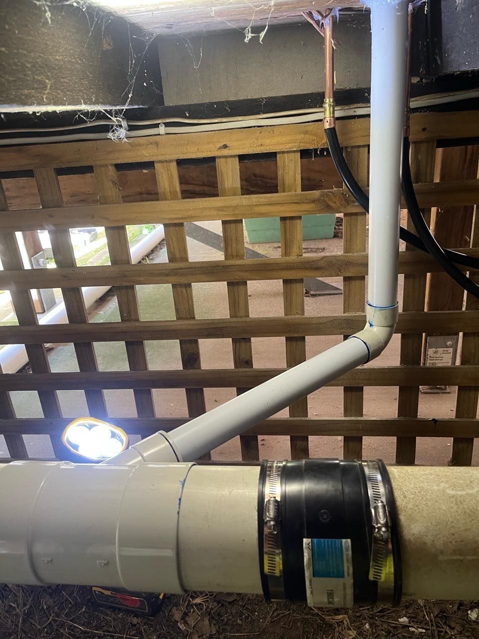 White Pvc Pipes for Sink Under House — JLH Plumbing, Gas & Roofing in South Nowra, NSW