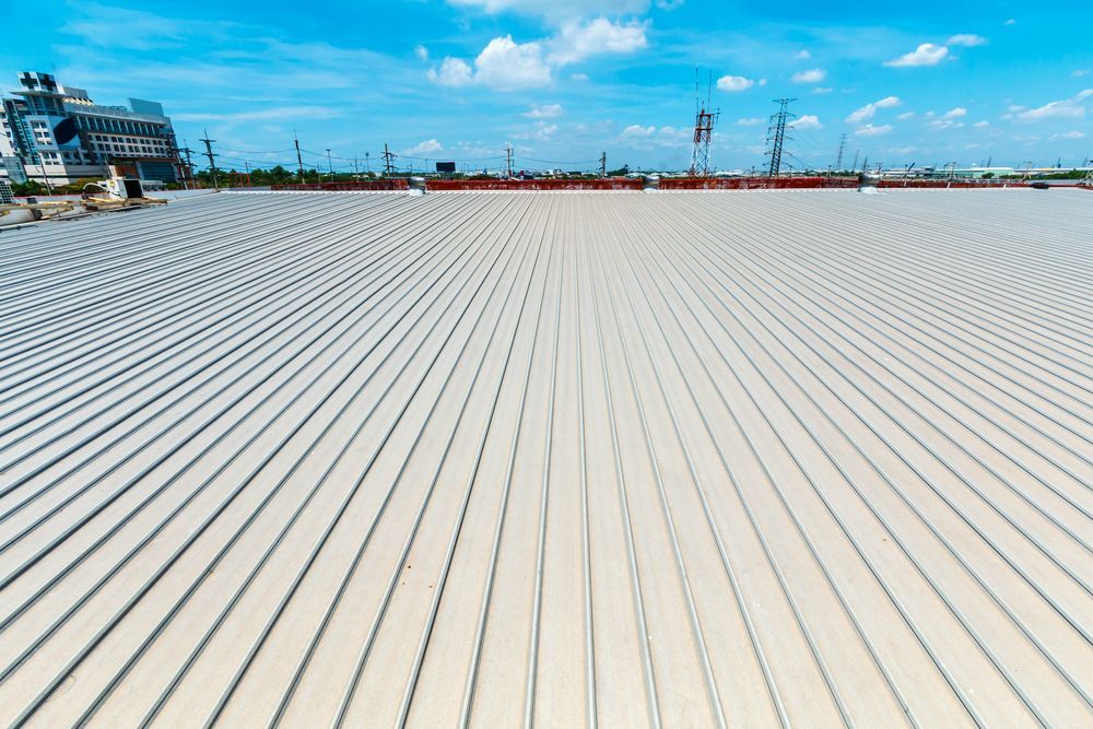 Rows of Evenly Spaced Light Structures on a Sandy Ground — JLH Plumbing, Gas & Roofing in Batemans Bay, NSW