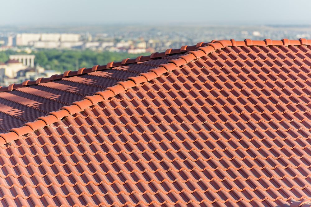 Red Tile Roof With City View — JLH Plumbing, Gas & Roofing in Shellharbour, NSW