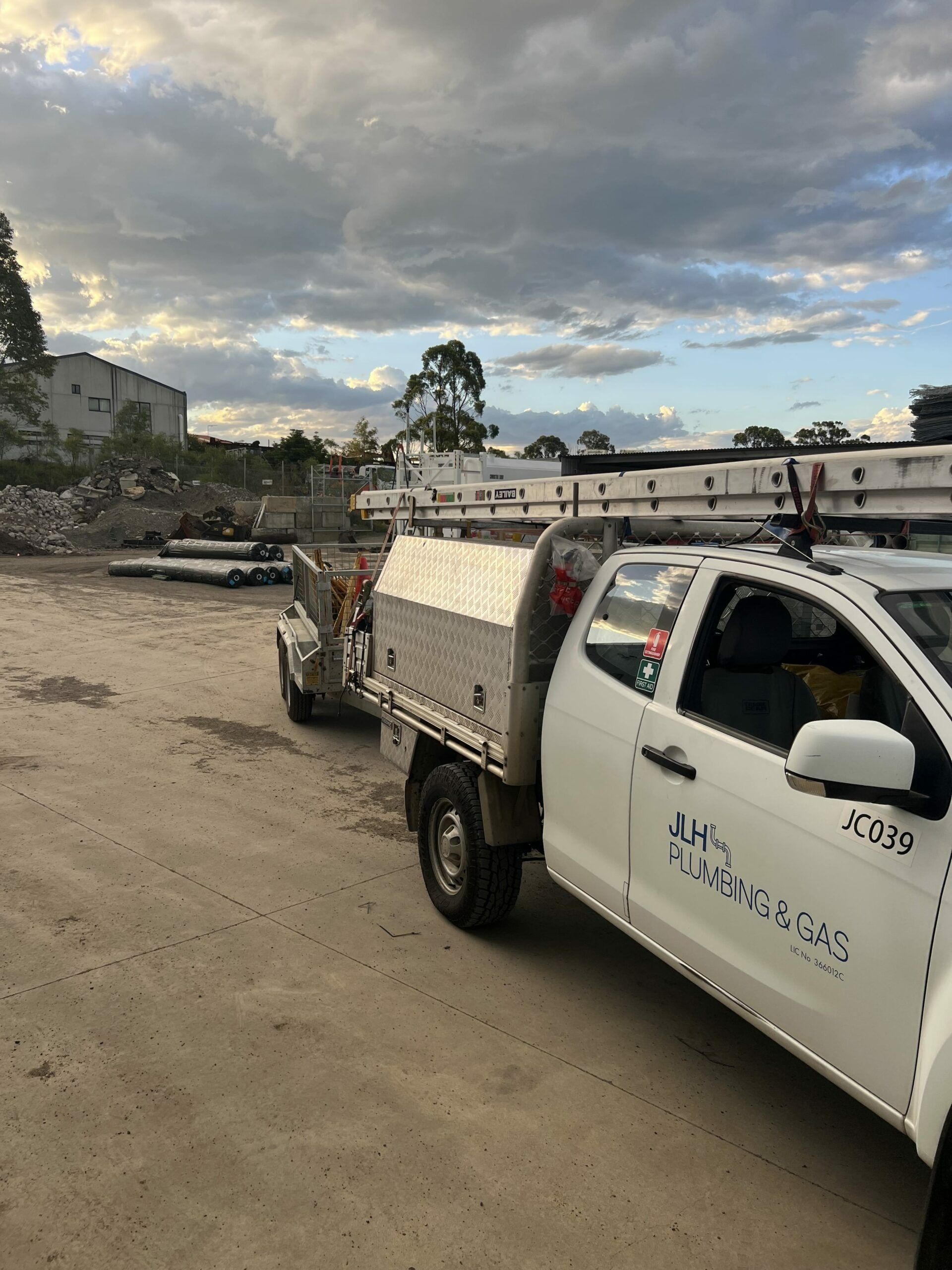White Pickup Truck With Trailer — JLH Plumbing, Gas & Roofing in South Nowra, NSW