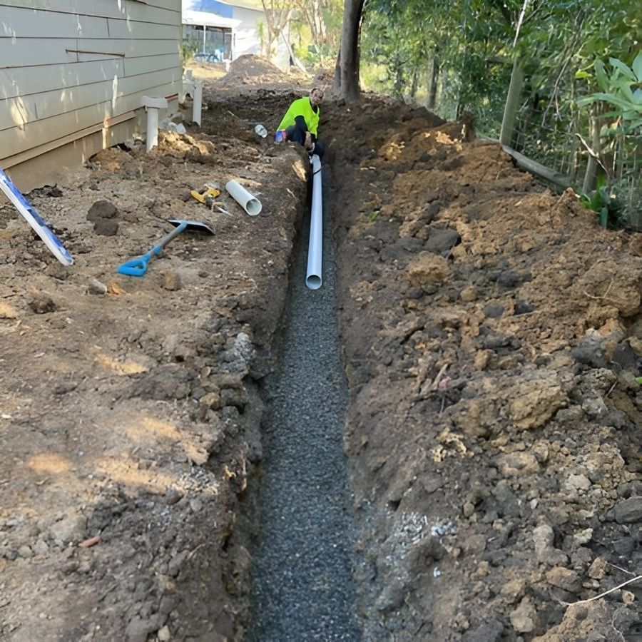 Construction Worker Installing a White Pipe — JLH Plumbing, Gas & Roofing in Wollongong, NSW