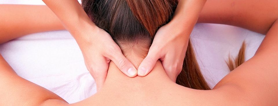 close up of a woman having chirporactic treatment on her neck