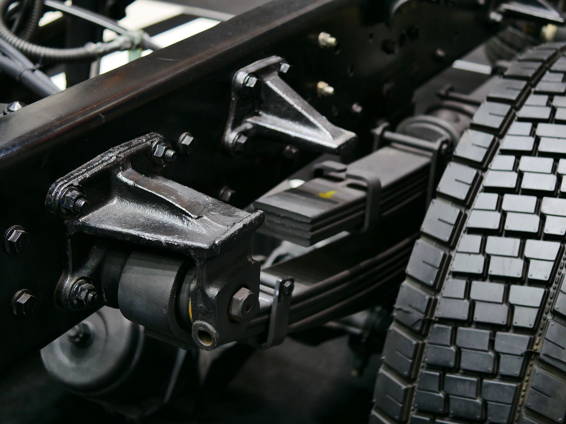 A close up of a suspension system on a truck