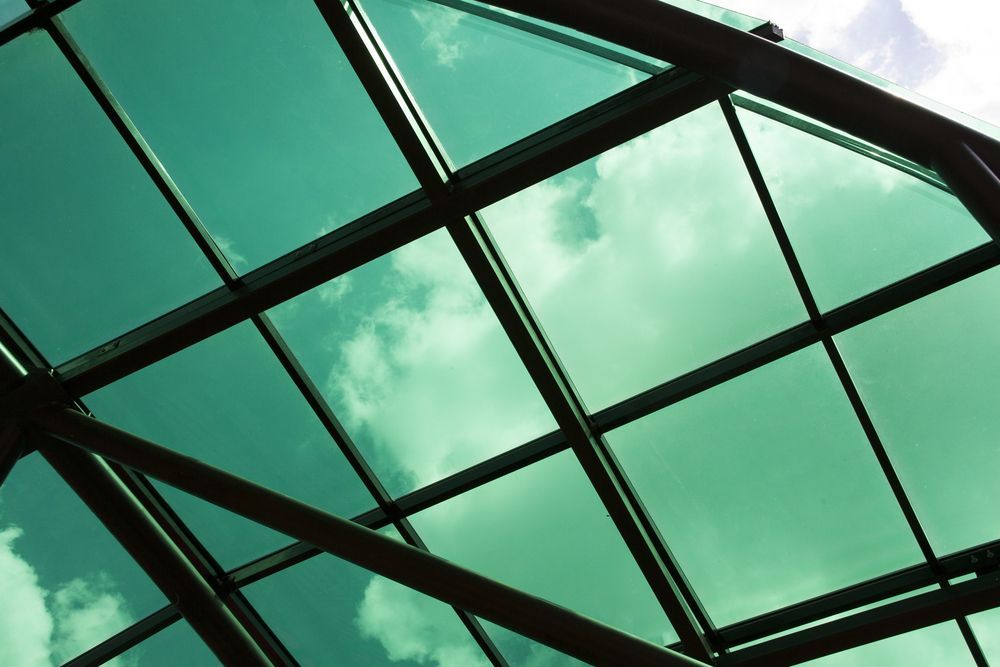 Looking up at a metal roof with a blue sky in the background — Fullerton's Plumbing Manufacture In Woree, QLD