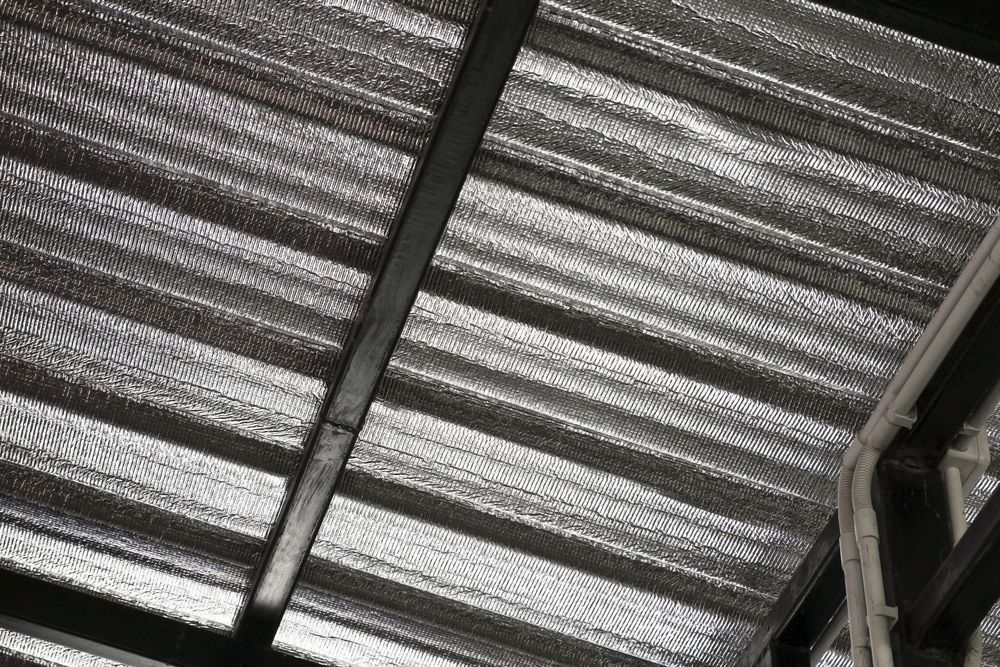 A Close Up Of A Roof With Aluminum Foil On It  — Fullerton's Plumbing Manufacture In Woree, QLD