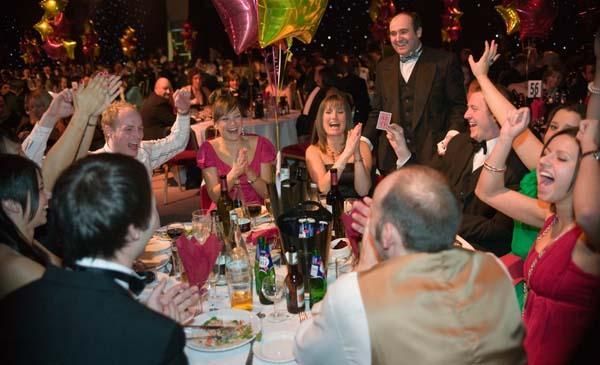 Paul Roberts Magician, amazing a crowd with incredible magic at a Leeds event