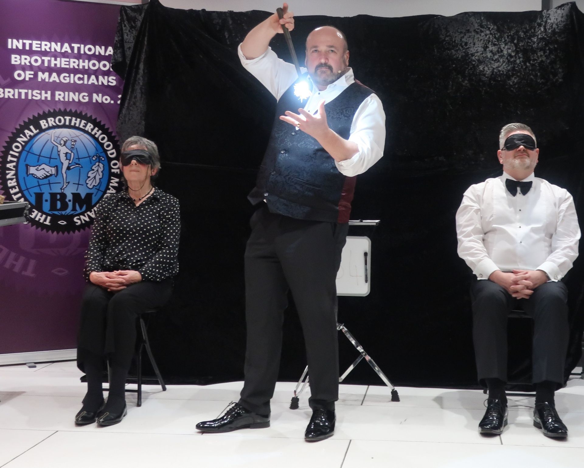 Paul Roberts performing as a stage magician at a corporate bash at a Liverpool venue