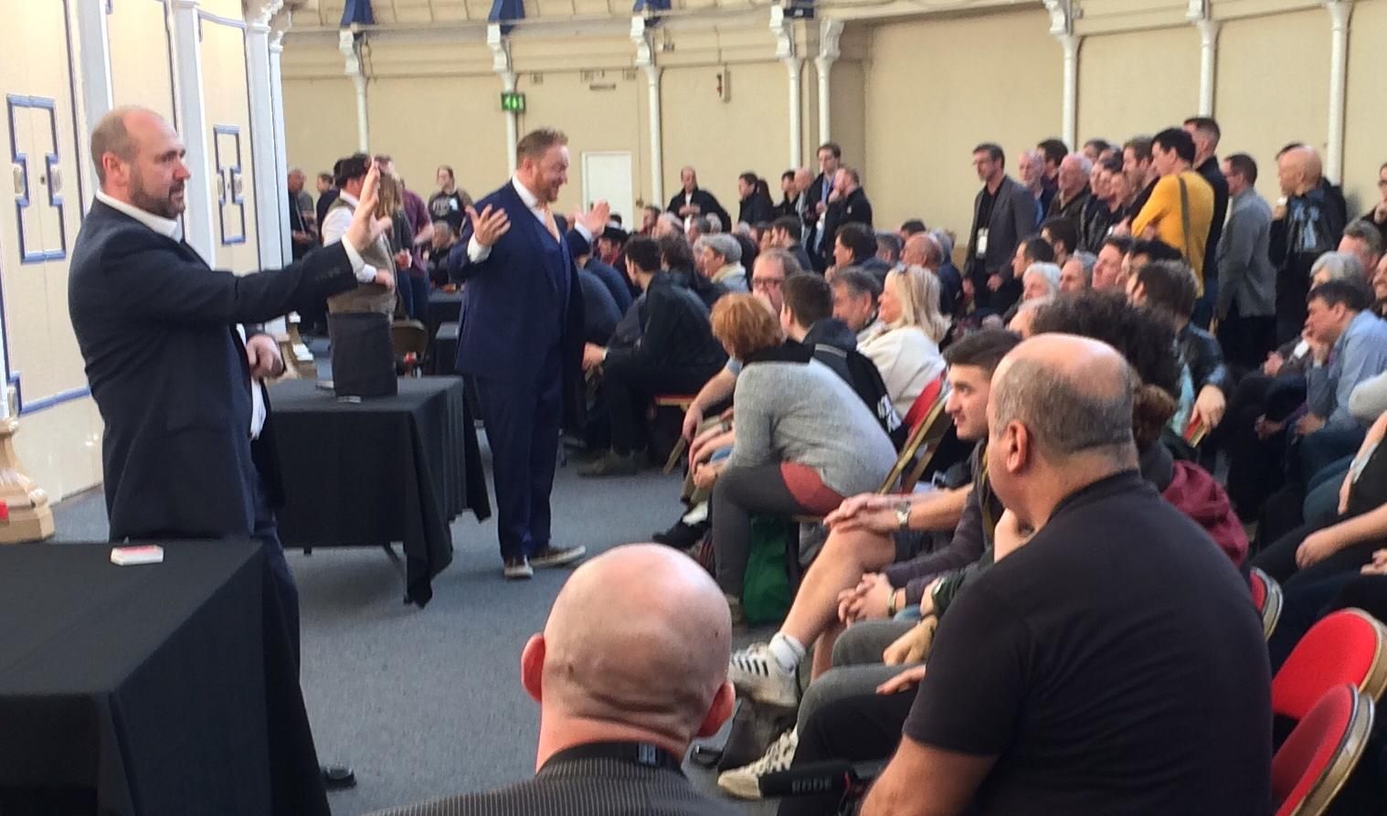 Trade show magician Manchester Paul Roberts attracting crowds at an exhibition