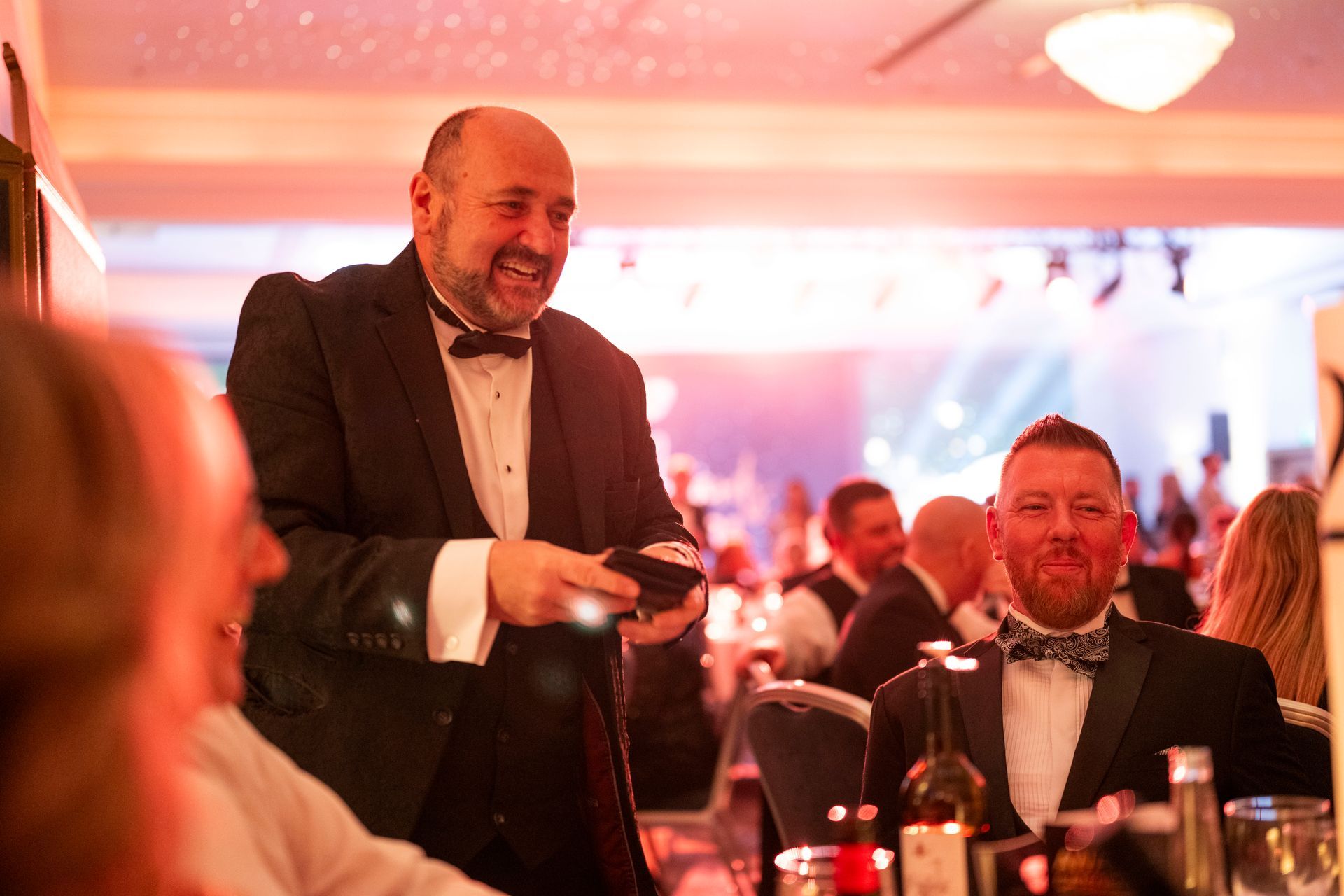 Wedding Magician Paul Roberts entertains a group of people at a Leeds wedding event.