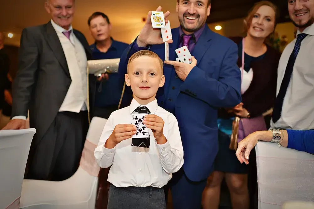 Paul Magician making people happy using his magic skills at a wedding.