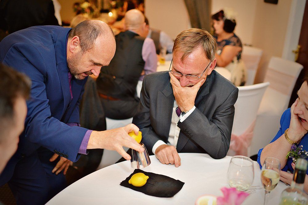 Paul Roberts the Magician performing to a Table of guests at a recent event