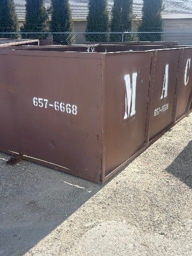 Brown metal dumpster with 