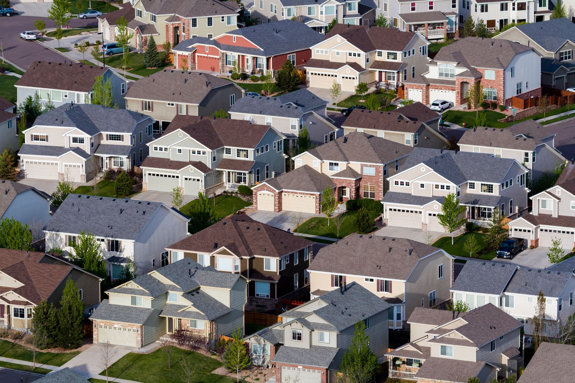 A suburban development with different residential roofs.