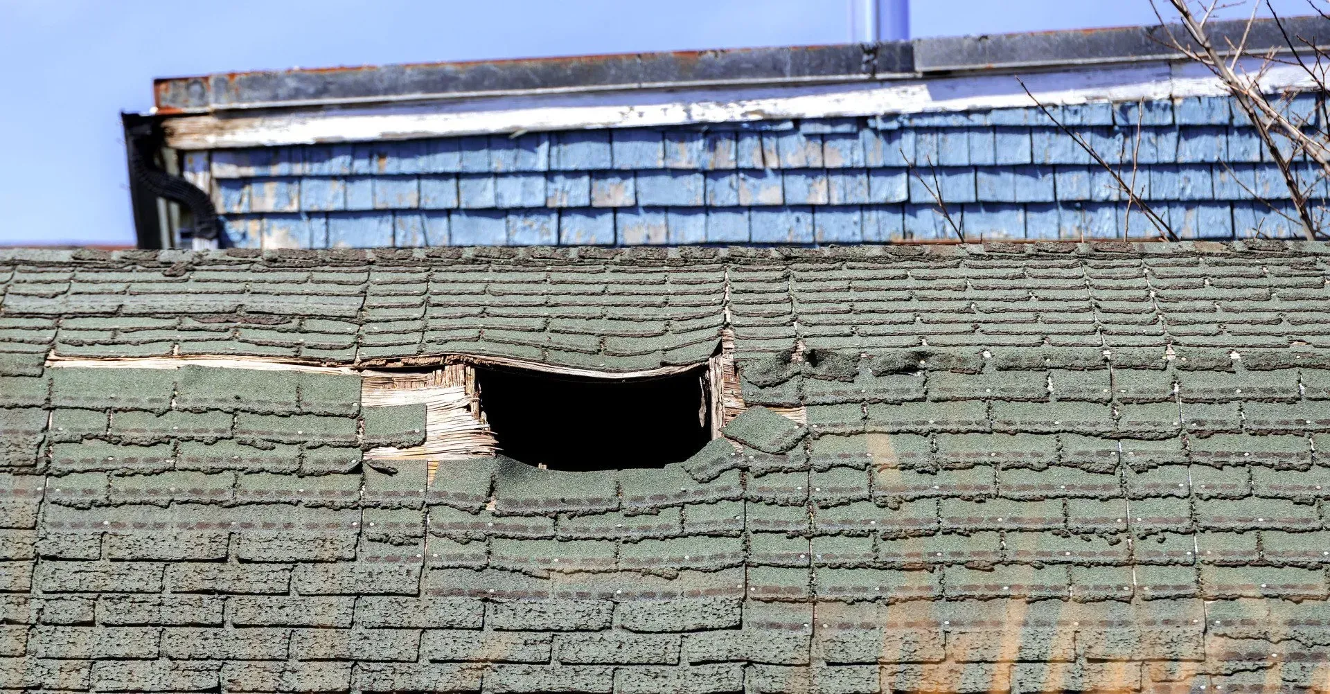 There is a hole in the roof of a building.