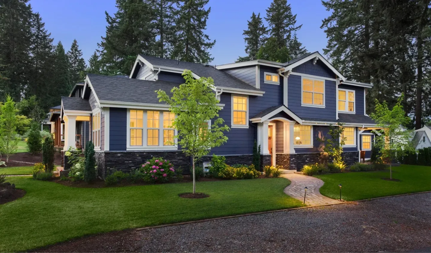 A large blue and white house with lots of windows