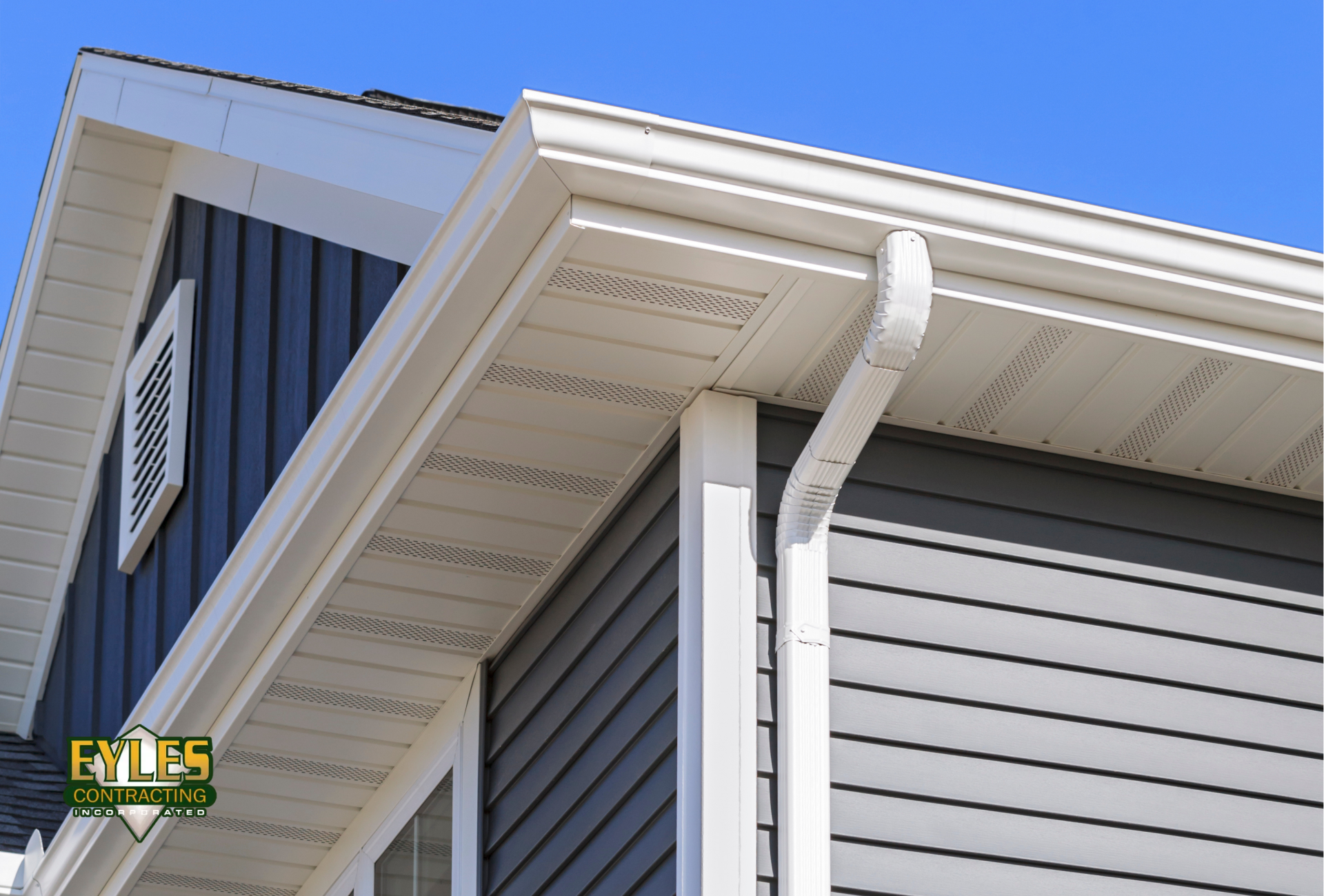 A residential home with a visible gutter system running along the roofline