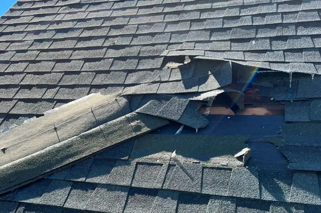 A close up of a roof with a hole in it.