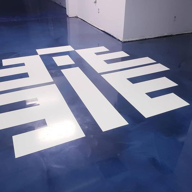 the word file is painted on a blue floor