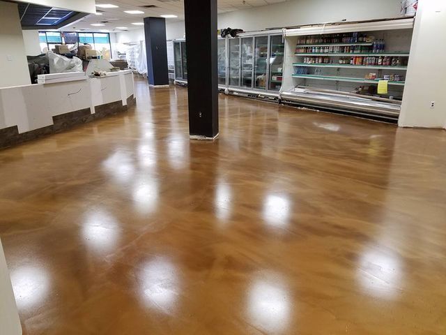 a large room with a wooden floor and a counter .