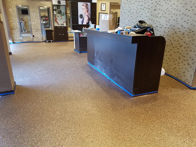 a reception desk in a room with a carpeted floor