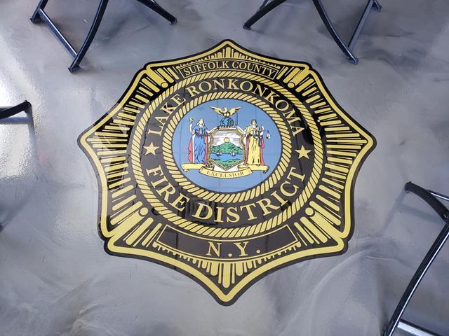 the lake ronkonkoma fire district logo is on the floor