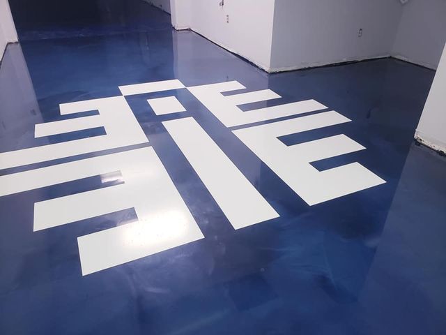 a blue floor with white letters that say eee